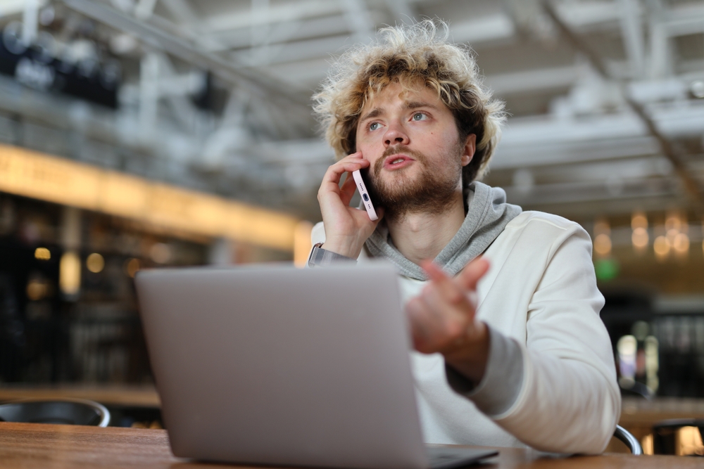 Young manager talking on the smartphone